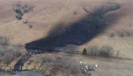 Emergency crews work to clean up the largest US crude oil spill in nearly a decade, following the leak at the pipeline operated by TC Energy in rural Washington County, Kansas, US, December 9, 2022. REUTERS/Drone Base
