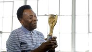 Legendary Brazilian football player Pele poses for a portrait with his 1958 World Cup trophy during an interview in New York, US, on April 26, 2016. REUTERS/Lucas Jackson/
