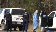 Police work near the scene of a fatal shooting, where police shot multiple people at a remote Queensland property after an ambush in which two officers and a bystander were also killed, in Wieambilla, Australia, December 13, 2022. AAP Image/Jason O'Brien via REUTERS 