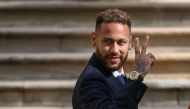 In this file photo taken on October 18, 2022, Paris Saint-Germain's Brazilian forward Neymar gestures as he leaves after attending a hearing at the courthouse in Barcelona, on the second day of his trial. (Photo by Josep Lago / AFP)