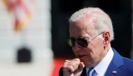 US President Joe Biden coughs during a signing event for the CHIPS and Science Act of 2022, on the South Lawn of the White House in Washington, US, August 9, 2022. File Photo / Reuters
