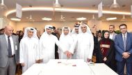 Masraf Al Rayan officials celebrate Qatar National Day at its headquarters in Lusail.
