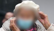 (Files) This file photo taken on December 6, 2022 shows defendant Irmgard F as she waits for the continuation of her trial at court in Itzehoe, northern Germany. (Photo by Marcus Brandt / POOL / AFP) / GERMAN COURT 