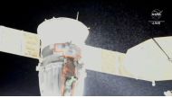 File photo: A stream of particles, which NASA says appears to be liquid and possibly coolant, sprays out of the Soyuz spacecraft on the International Space Station, forcing a delay of a routine planned spacewalk by two Russian cosmonauts December 14, 2022 in this still image taken from video. NASA TV/Handout via Reuters