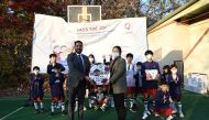 Officials from the Qatargas Korea Liaison Office present football gear to children at the Myoungryun Child Welfare Centre in Seoul as part of a 