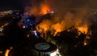 A forest fire affects the hills of Vina del Mar, where hundreds of houses are located, in the Valparaiso Region, Chile, on December 23, 2022. Photo by JAVIER TORRES / AFP