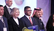 QU Professor Dr. Raed Al Gharabat (fourth left) during the award ceremony.