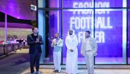Football legend David Beckham; Dean VCUarts Qatar Amir Berbić; and others view the window displays.