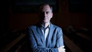 In this file photo taken on September 05, 2022 Bulgarian investigative journalist and lead Russia investigator with Bellingcat Christo Grozev poses for a photo session at the Institute of Political Studies (Sciences Po) in Paris.  (Photo by JULIEN DE ROSA / AFP)