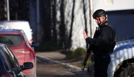 A Kosovo police officer patrols in the northern part of the ethnically-divided town of Mitrovica, Kosovo, December 28, 2022. REUTERS/Florion Goga
