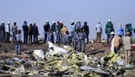 File Photo: Ethiopian Federal policemen stand at the scene of the Ethiopian Airlines Flight ET 302 plane crash, near the town of Bishoftu, southeast of Addis Ababa, Ethiopia, March 11, 2019. (REUTERS/Tiksa Negeri)