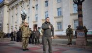 Ukraine's President Volodymyr Zelenskiy sings the national anthem during his visit in Kherson, Ukraine, on November 14, 2022.  File Photo / Reuters