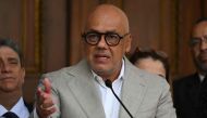The president of the Venezuelan National Assembly, Jorge Rodriguez, gestures while speaking with the press before an extraordinary session at the National Assembly in Caracas on December 31, 2022. (Photo by Federico PARRA / AFP)