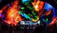 In this file photo taken on January 10, 2020 attendees experience the LG OLED Wave made up of 200 55-inch LG OLED digital screens on the final day of the 2020 Consumer Electronics Show (CES) in Las Vegas, Nevada. Photo by Robyn Beck / AFP
