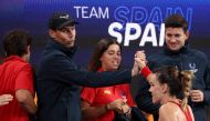 Spain's Rafael Nadal greets teammate Nuria Diaz (right) for her victory against Australia's Maddison Inglis after their women's singles match on day five of the United Cup tennis tournament in Sydney on January 2, 2023. (Photo by DAVID GRAY / AFP)