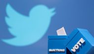 3D-printed ballot boxes are seen in front of a displayed Twitter logo in this illustration taken on November 4, 2020. File Photo / Reuters
