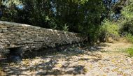 A general view of a weir and dried riverbed near the source of the River Thames, in Kemble, in Gloucestershire, Britain August 10, 2022. REUTERS/Lucy Marks/File Photo
