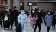 People arrive to Shanghai Hongqiao International Airport, in Shanghai on January 7, 2023. (Photo by Hector RETAMAL / AFP)