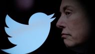Twitter logo and a photo of Elon Musk are displayed through magnifier in this illustration taken on October 27, 2022. File Photo / Reuters