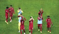Qatar players acknowledge the crowd after defeating Kuwait in their opening match of the 25th Arabian Gulf Cup in Basra, on Saturday. Pictures: Osama Abdullah Alrosan