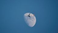 A Turkish Airlines Airbus A321-231 aircraft flies past the moon as it descends for Istanbul Airport in Istanbul, Turkey, January 1, 2023. (REUTERS/Yoruk Isik/File Photo)