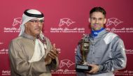 QREC Racing Manager, Abdulla Rashid Al Kubaisi after presenting the trophy to Tomas Lukasek. 
