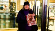 Caroline Lennon, the first person to purchase the copy of Britain's Prince Harry's autobiography 'Spare' from Waterstones bookstore, poses next to the store, in London, Britain on January 10, 2023. REUTERS/Peter Nicholls,
