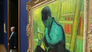 In this file photo taken on June 17, 2005, a man walks past Vincent Van Gogh's 
