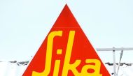Logo of Swiss chemical group Sika is seen on a snow-covered roof of a branch in Berikon, Switzerland on February 12, 2021. File Photo / Reuters
