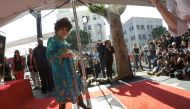Italian actor Gina Lollobrigida poses on her star after it was unveiled on the Hollywood Walk of Fame in Los Angeles, California, U.S., February 1, 2018. REUTERS/Mario Anzuoni/File Photo