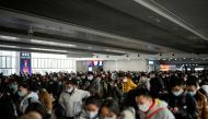 People wait to board a train at a railway station during the annual Spring Festival travel rush ahead of the Chinese Lunar New Year, as the coronavirus disease (COVID-19) outbreak continues, in Shanghai, China January 16, 2023. REUTERS/Aly Song/File Photo
