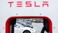 Tesla owners use charging stations in a parking lot on January 17, 2023 in Springfield, Virginia. The automaker decreased the prices of their Tesla's by 20 percent, a move seen as a reaction to competition in the global market for electric vehicles and rising inflation rates. Anna Moneymaker/Getty Images/AFP
