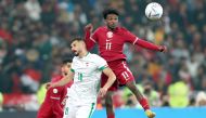 Qatar’s Amro Siraj (right) in action during semi-final against Iraq on Monday. 