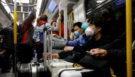Travellers take the first train to Hong Kong's Lok Ma Chau border checkpoint on the first day China reopens the border amid the coronavirus disease (COVID-19) pandemic in Hong Kong, China, January 8, 2023. REUTERS/Tyrone Siu/File Photo