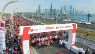 Runners stand at the start line for 2023 Doha Marathon by Ooredoo yesterday. 