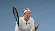 Belarus' Victoria Azarenka celebrates after victory against China's Zhu Lin during their women's singles match on day seven of the Australian Open tennis tournament in Melbourne on January 22, 2023. (Photo by Paul CROCK / AFP)