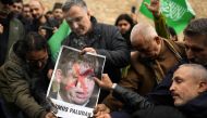 People set on fire a photograph of far right activist Rasmus Paludan during a protest outside the Swedish consulate in Istanbul, Turkey, Sunday, Jan 22, 2023. File Photo: Francisco Seco/AP