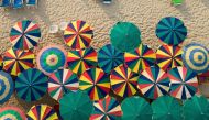 Colourful umbrellas are seen in a restaurant as tourists enjoy a beach on the island of Phuket in Thailand on January 19, 2023. (REUTERS/Jorge Silva)