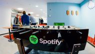 In this file photo taken on February 18, 2015, the Spotify logo is pictured on a football table placed in a playroom at the company headquarters in Stockholm. (Photo by Jonathan Nackstrand / AFP)