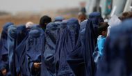 
File Photo: Displaced Afghan women stand waiting to receive cash aid for displaced people in Kabul, Afghanistan, July 28, 2022. (REUTERS/Ali Khara)
