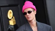 In this file photo taken on April 03, 2022, Canadian singer and songwriter Justin Bieber arrives for the 64th Annual Grammy Awards at the MGM Grand Garden Arena in Las Vegas. - Bieber has sold his shares of his music publishing and recording catalog to the Blackstone-backed Hipgnosis Songs Capital, Hipgnosis said on January 24, 2023.  (Photo by ANGELA WEISS / AFP)