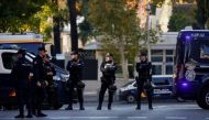 FILE PHOTO: Police officers stand outside the U.S. Embassy in Madrid after a suspected explosive device hidden in an envelope was mailed to the embassy, in the wake of other packages sent to targets connected to Spanish support of Ukraine, amidst Russia’s invasion of Ukraine, in Madrid, Spain December 1, 2022. REUTERS/Juan Medina

