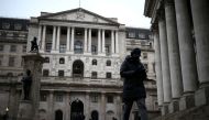 People walk outside the Bank of England in the City of London financial district, in London, Britain, January 26, 2023. REUTERS/Henry Nicholls