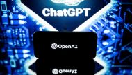 This picture taken on January 23, 2023 in Toulouse, southwestern France, shows screens displaying the logos of OpenAI and ChatGPT. ChatGPT is a conversational artificial intelligence software application developed by OpenAI. (Photo by Lionel Bonaventure / AFP)