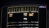 The logo of the Adani Group is seen on the facade of its Corporate House on the outskirts of Ahmedabad, India, on January 27, 2023. REUTERS/Amit Dave/File Photo