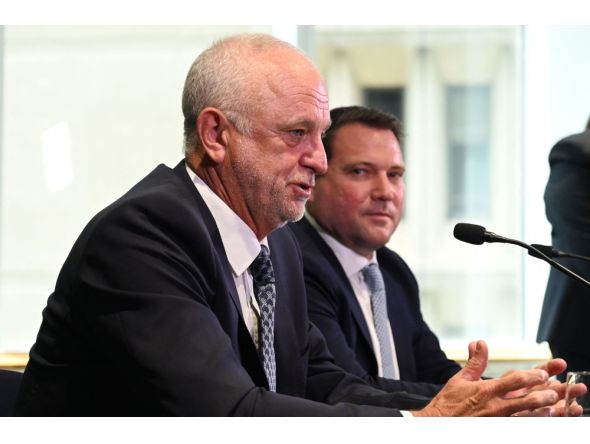File photo: Arnold graham (L) speaks at a press conference