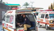 :TOPSHOT - An ambulance transports injured blast victims outside the police headquarters in Peshawar on January 30, 2023. - A blast at a mosque inside a police headquarters in Pakistan on January 30 killed and wounded worshippers, hospital officials said. (Photo by Abdul MAJEED / AFP)

