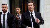 Tesla CEO Elon Musk and his security detail depart the company’s local office in Washington, US on January 27, 2023. REUTERS/Jonathan Ernst
