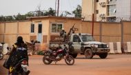 In this file photo taken on September 30, 2022 Burkina Faso soldiers are seen deployed in Ouagadougou. - An attack by suspected jihadists in northern Burkina Faso has killed 13 people, including 10 military police, the army said on January 31, 2023. (Photo by Olympia DE MAISMONT / AFP)