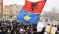 People wave Kosovo and Albanian flags as they protest against the Association of municipalities with a Serbian majority in Pristina, Kosovo, on January 31, 2023. REUTERS/Laura Hasani